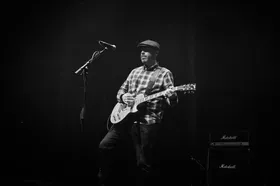 Rhyd Lewis playing guitar